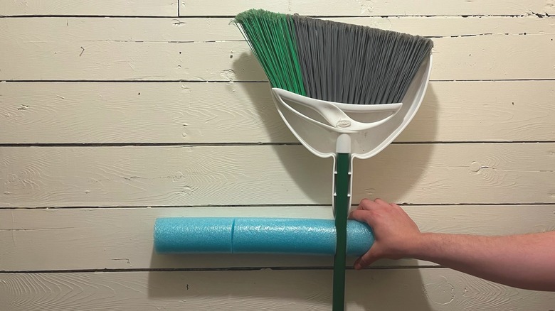 Broom held by pool noodle