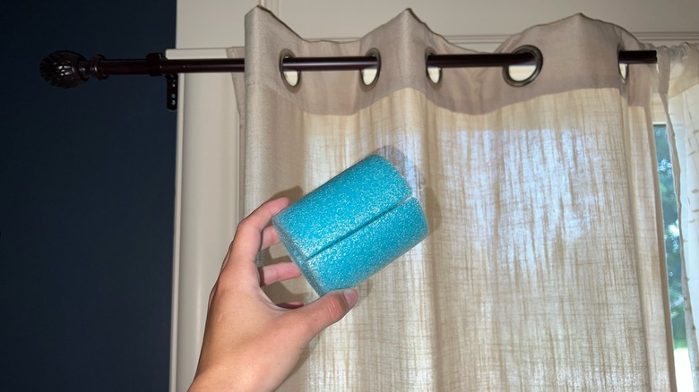 curtains and pool noodle piece