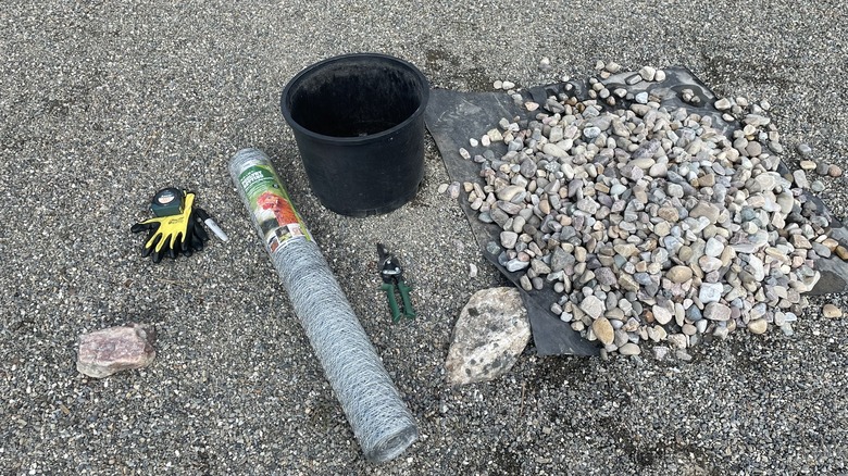 materials for making gabion basket planter, including wire, rocks, and tools