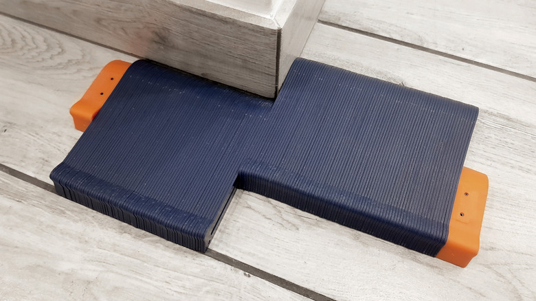 Contour gauge being used laying baseboard