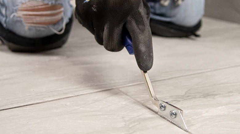 Close up grout saw being used