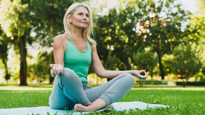 woman relaxing in a yard