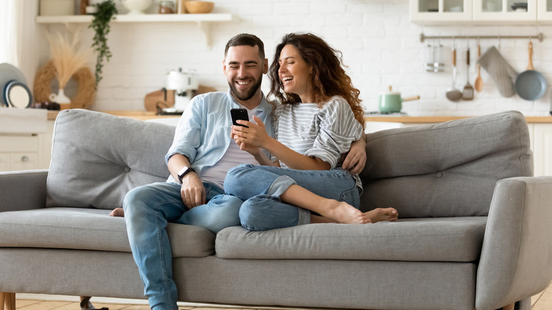 Man and woman  on sofa