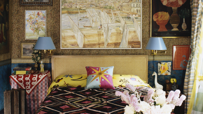 eclectic bedroom with various paintings