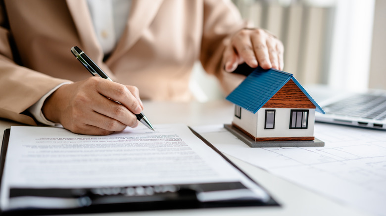 real estate agent with house contract