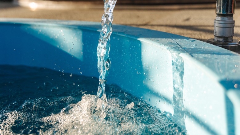 Water pouring into cold pool