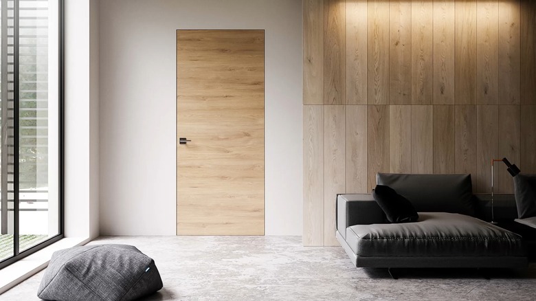 Living room with wooden frameless interior door