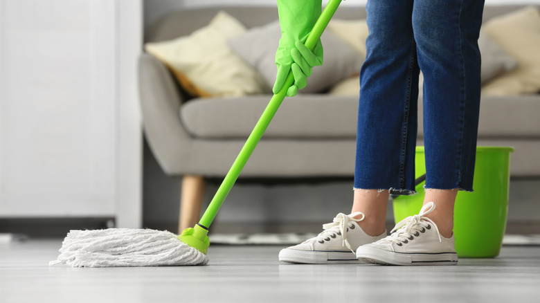 person mopping floor