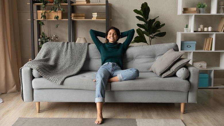 woman relaxing on couch