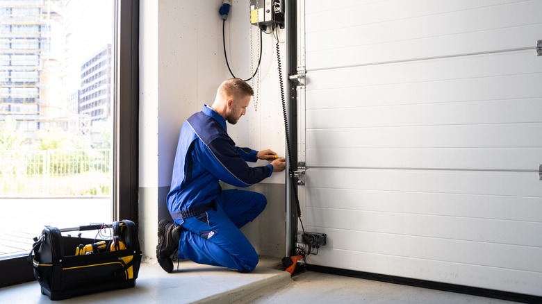 Man fixing a garage door