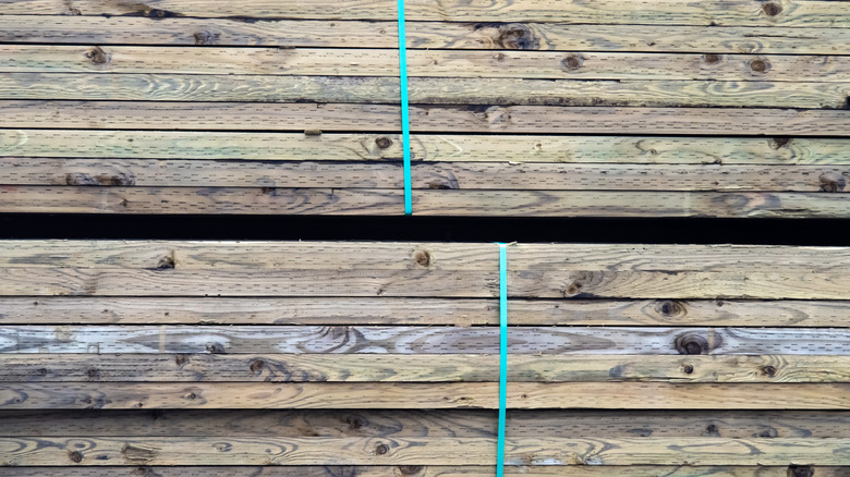 Stacks of pressure treated boards