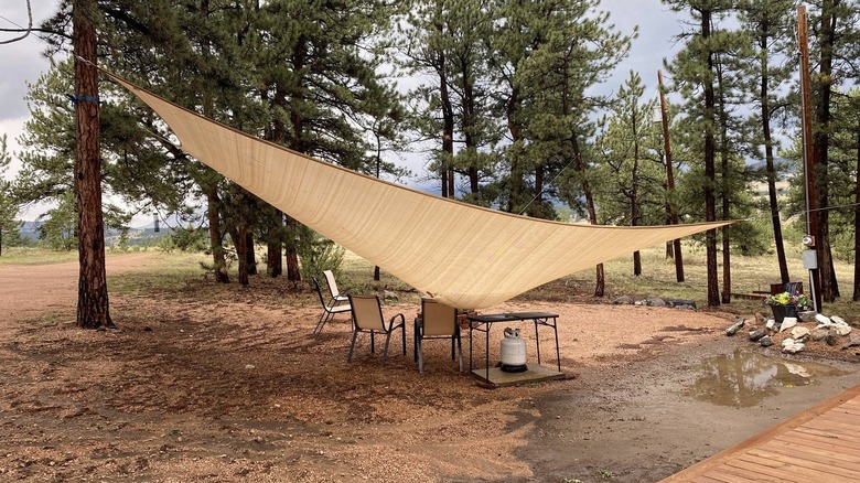 Picnic area with shade sail that sank after a hailstorm.