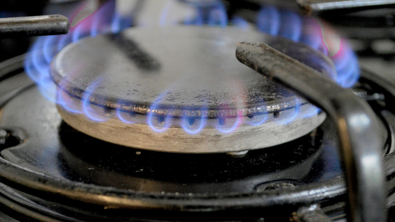 close up of burner head on gas stove