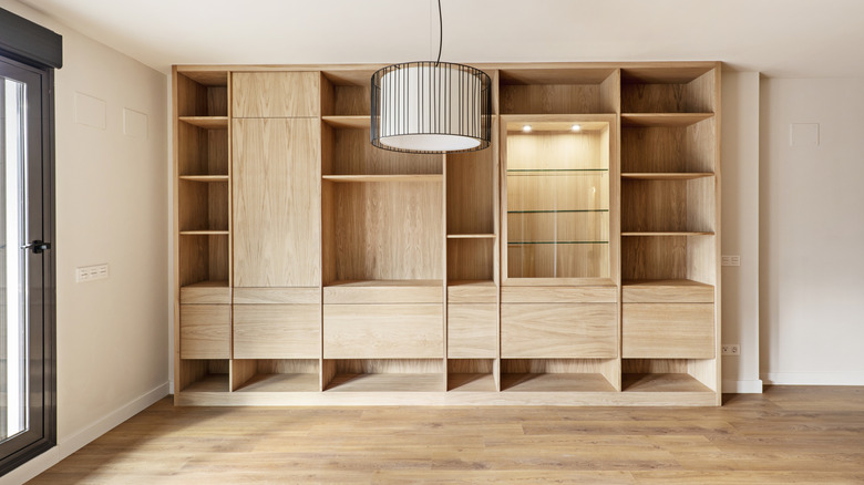 White oak cabinets against one wall in a room