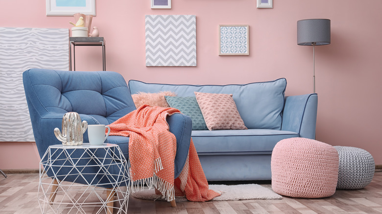 blue chair in a pink room