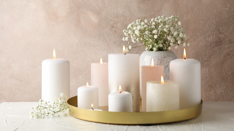 arrangement of candles and aromatics