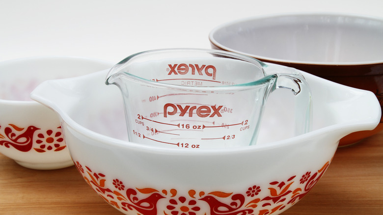 Pyrex bowls and measuring cups sitting out on a table