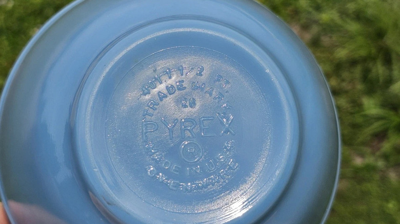 The bottom of a Pyrex Delphite blue bowl