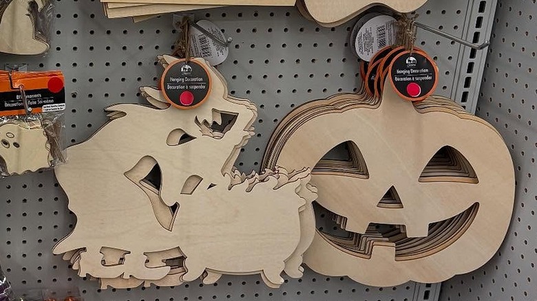 Halloween decor on Dollar Tree wall with red sticker over prices