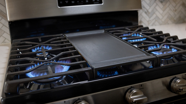 All four burners of a gas stove lit at once