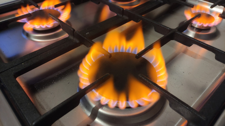 Orange flame on gas stovetop