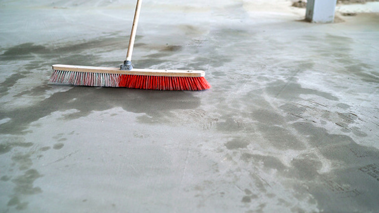 A push broom on concrete