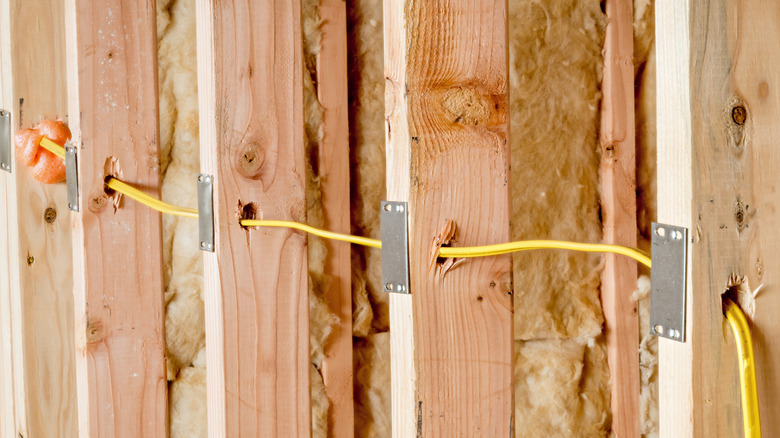Electrical wiring run through wall studs