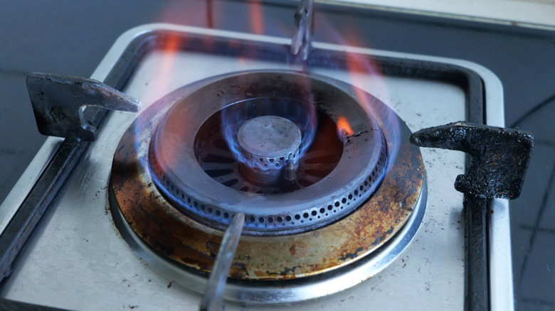 A high flame on a gas burner