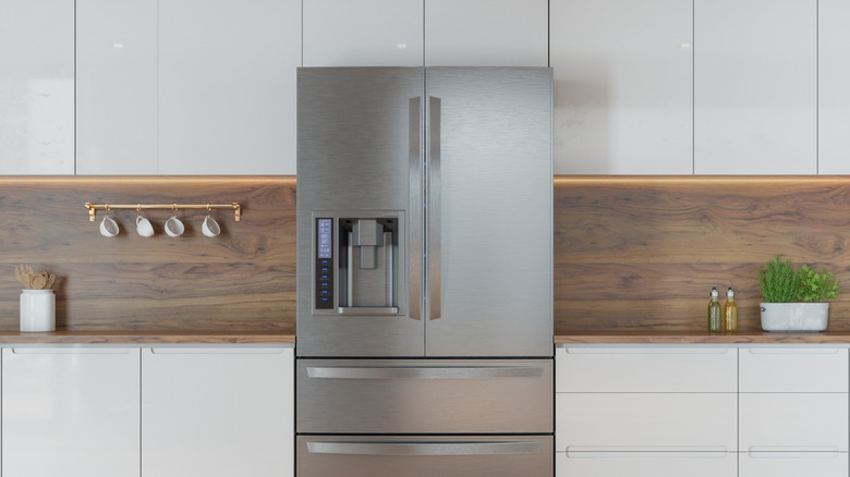 Modern kitchen with stainless steel fridge