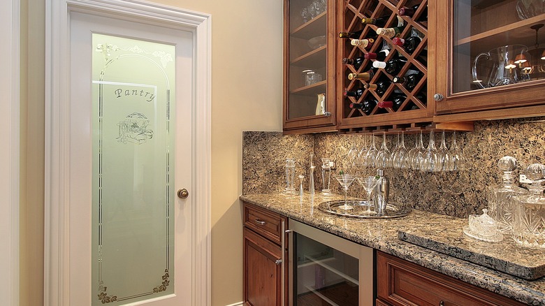 butler's pantry with wooden cabinets