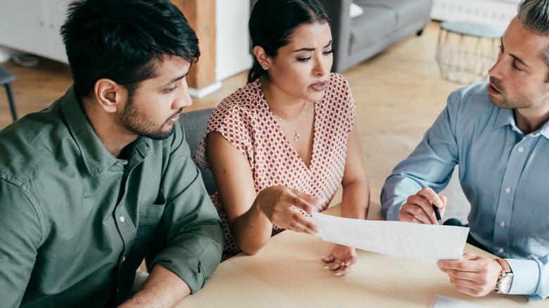 Couple working with realtor 