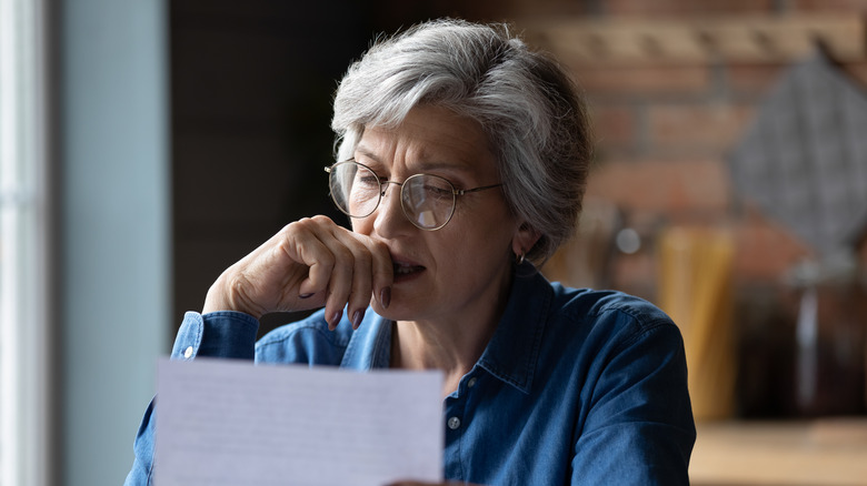 Woman holding a tax bill