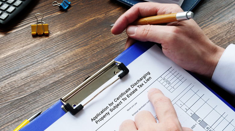 Tax lien document on cipboard