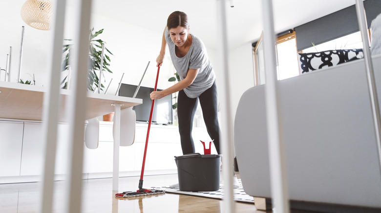 Woman mopping the floor