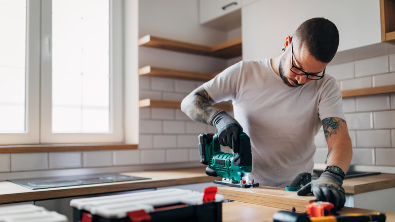 Man cutting wood with jigsaw