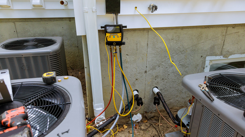 Technician repairing HVAC system