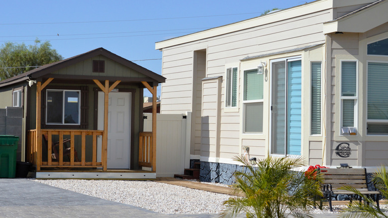 A tiny house ADU next to a larger home.