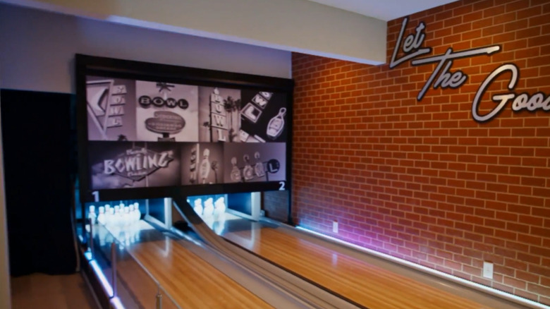 An at-home bowling alley in the basement of a home.