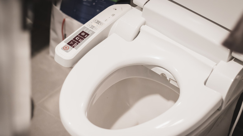 question mark falling into toilet