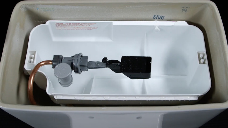 flapperless system in toilet tank