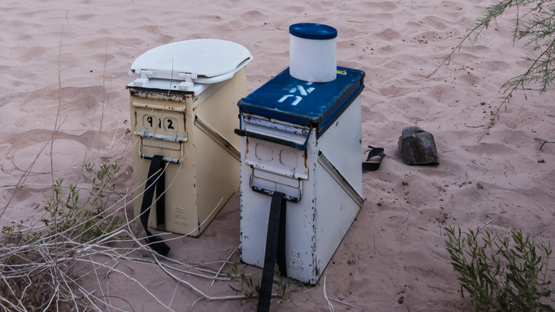 Groover toilet in sandy area