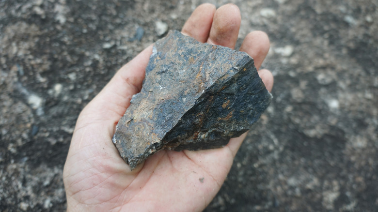 hand holding hematite stone