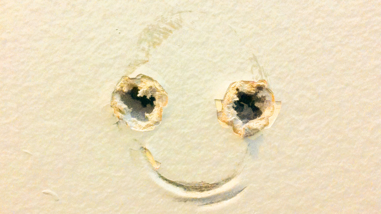 drywall holes smiley face