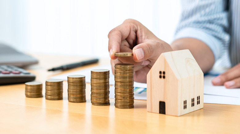 wooden house and counted coins