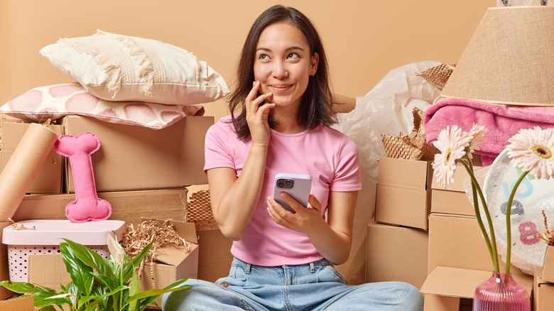 woman sitting with boxes