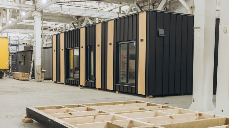 The inside of a factory where a modern manufactured home is being built