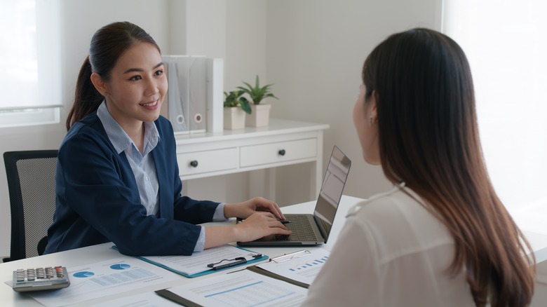 Person speaking with bank manager