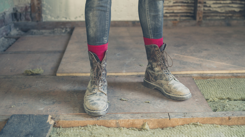 Person standing on a subflooring