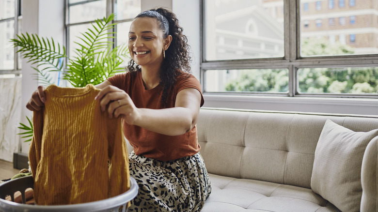 woman looking at shirt