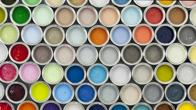 rows open paint cans 